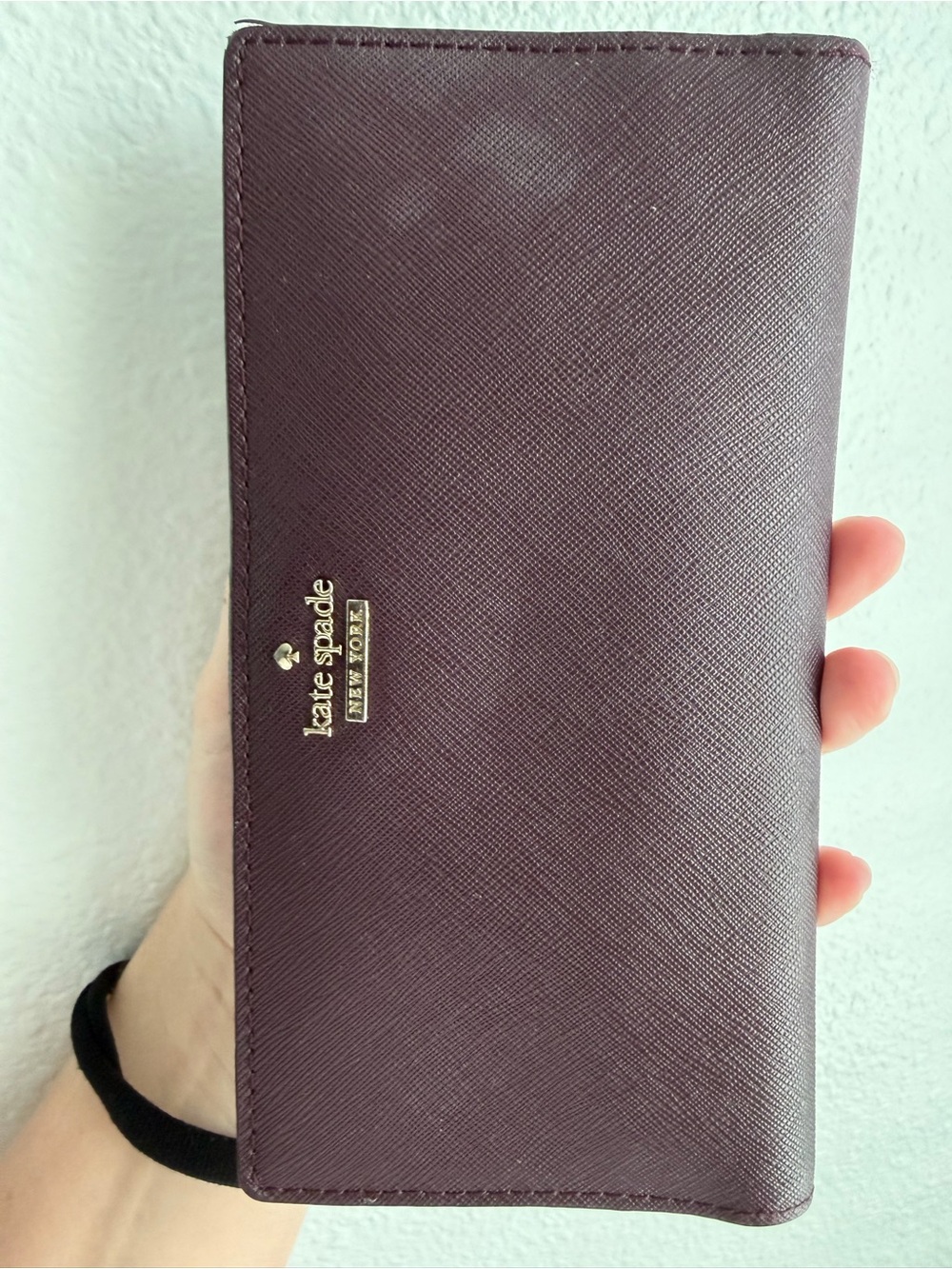 kate spade plum saffiano long wallet with gold logo